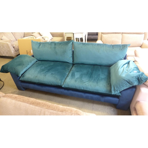 1575 - A teal and dark blue velvet four seater sofa