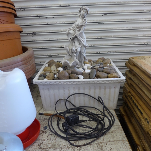 2194 - Self-contained water fountain with statue, stones & pump