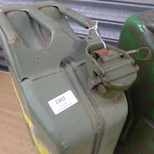 2302 - Three vintage green metal 20 litre jerry cans