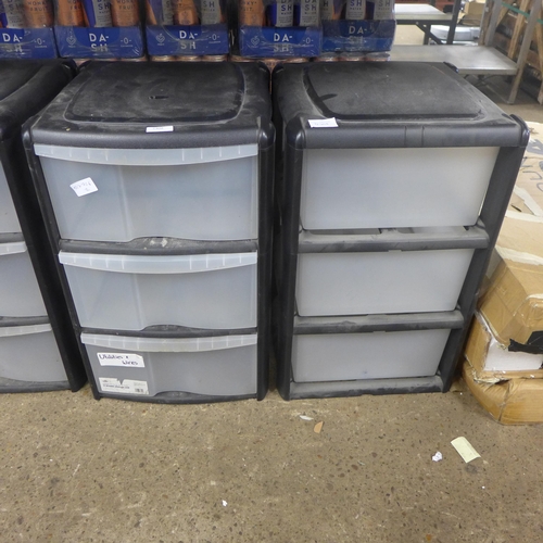 2308 - Two black plastic three drawer box storage units