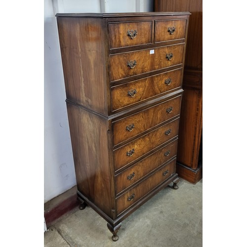 130 - A George I style walnut chest on chest