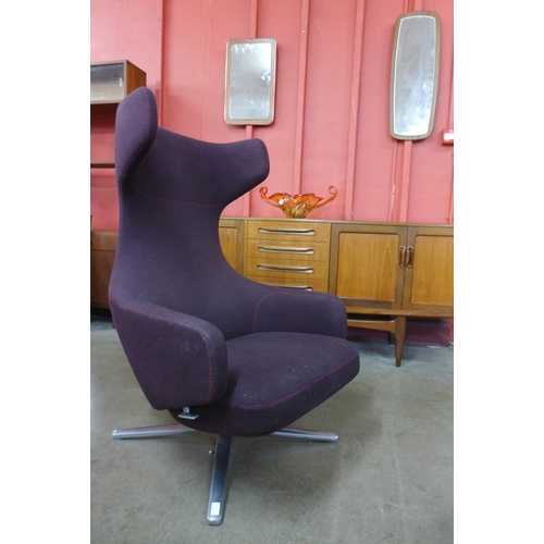 1 - A Vitra Grand Repos chrome and aubergine fabric upholstered revolving lounge chair, designed by Anto... 