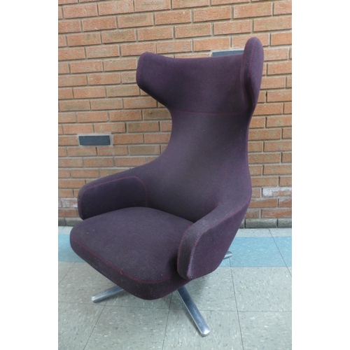 1 - A Vitra Grand Repos chrome and aubergine fabric upholstered revolving lounge chair, designed by Anto... 