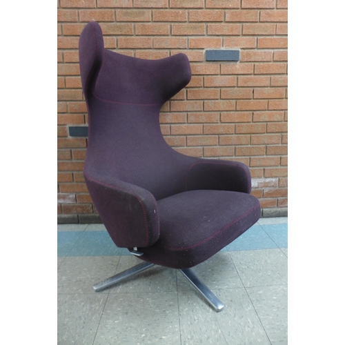 1 - A Vitra Grand Repos chrome and aubergine fabric upholstered revolving lounge chair, designed by Anto... 