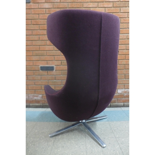 1 - A Vitra Grand Repos chrome and aubergine fabric upholstered revolving lounge chair, designed by Anto... 