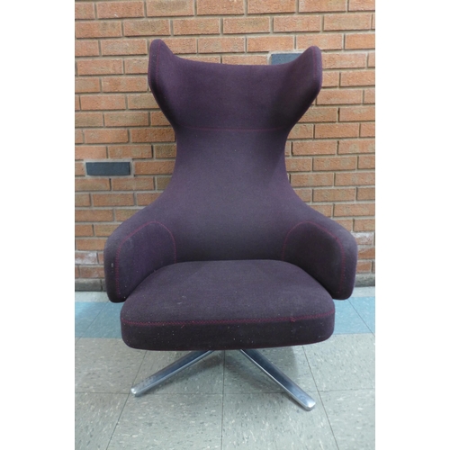 1 - A Vitra Grand Repos chrome and aubergine fabric upholstered revolving lounge chair, designed by Anto... 