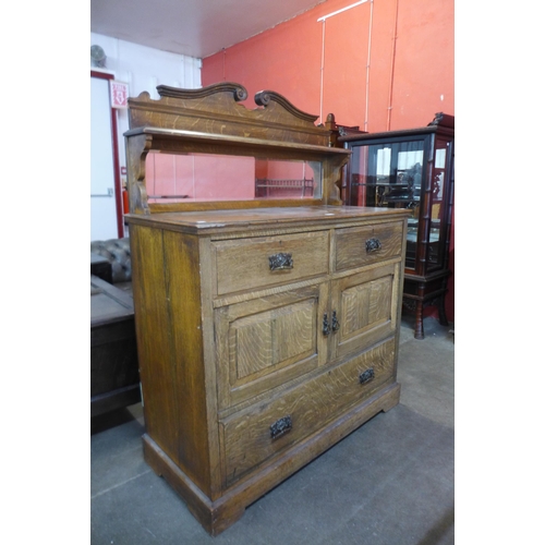 103 - A Victorian oak mirrorback side cabinet