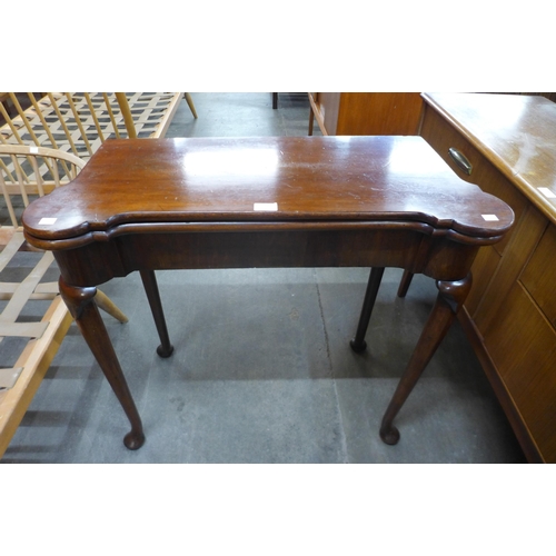 108 - A George III Irish mahogany fold over gaming table, made by R. Strahan & Co. Ltd., 135 St. Stephens ... 