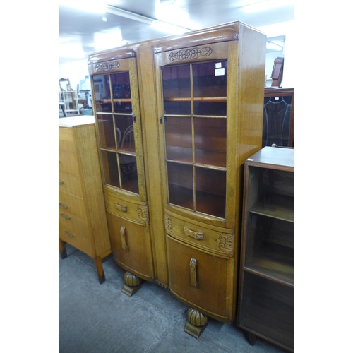 116 - A carved oak four door bookcase