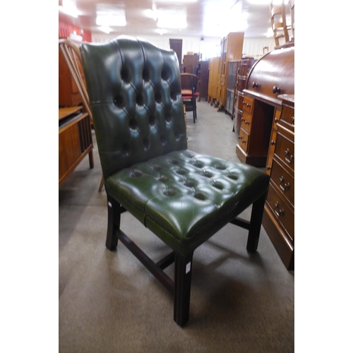 120 - A Regency style mahogany and green leather library chair