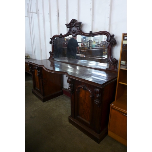 125 - A Victorian mahogany mirrorback pedestal sideboard