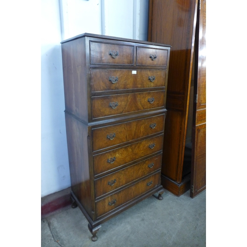 130 - A George I style walnut chest on chest