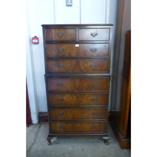 130 - A George I style walnut chest on chest