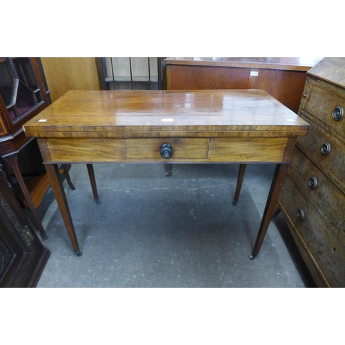 132 - A George III inlaid mahogany rectangular fold over games table