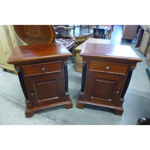 142 - A pair of French Empire style hardwood bedside cabinets