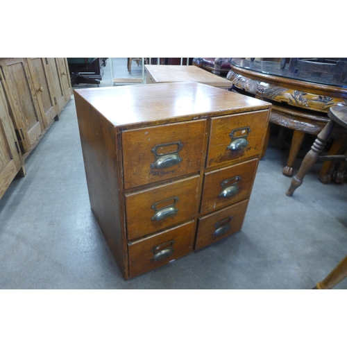 165 - An early 20th Century oak six drawer index cabinet