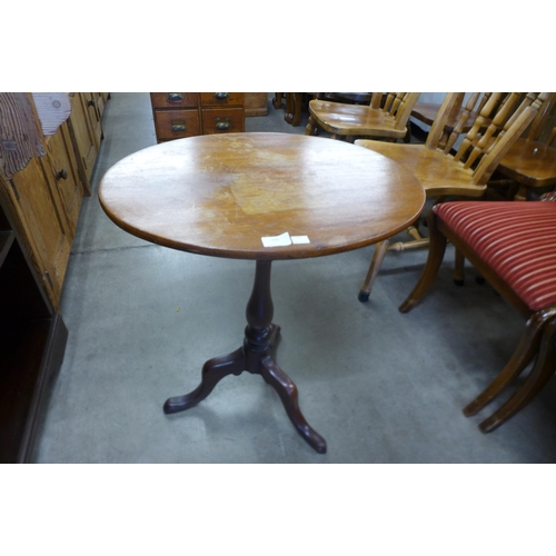 166 - A Victorian mahogany tripod wine table