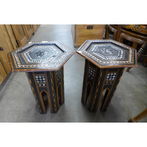 167 - A pair of Islamic ebonised and mother of pearl inlaid octagonal occasional  tables