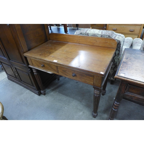 169 - A George IV mahogany two drawer writing table