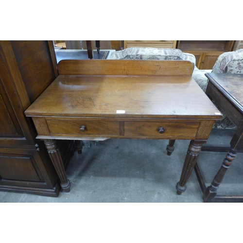 169 - A George IV mahogany two drawer writing table