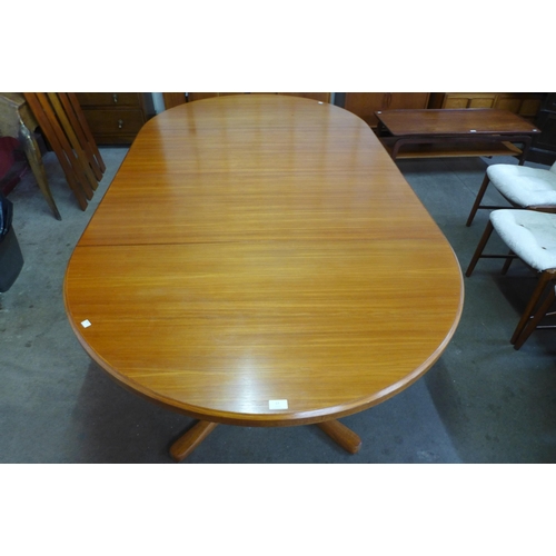 17 - A Danish teak extending dining table