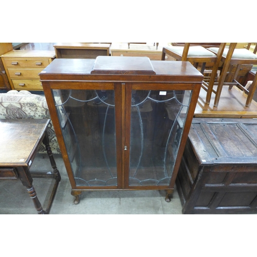 170 - An Art Deco oak two door display cabinet