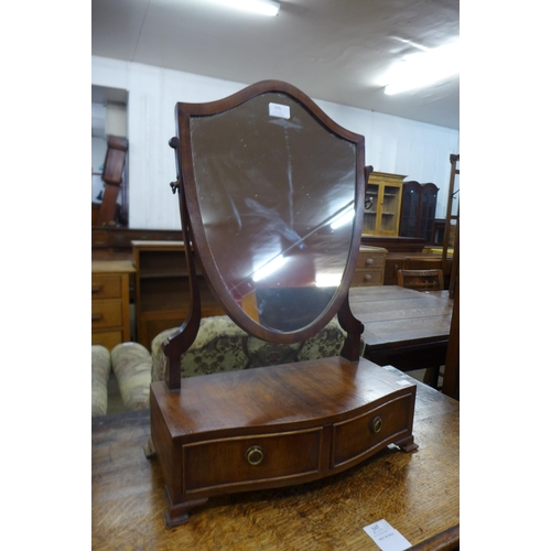 175 - A George III style mahogany shield shaped toilet mirror