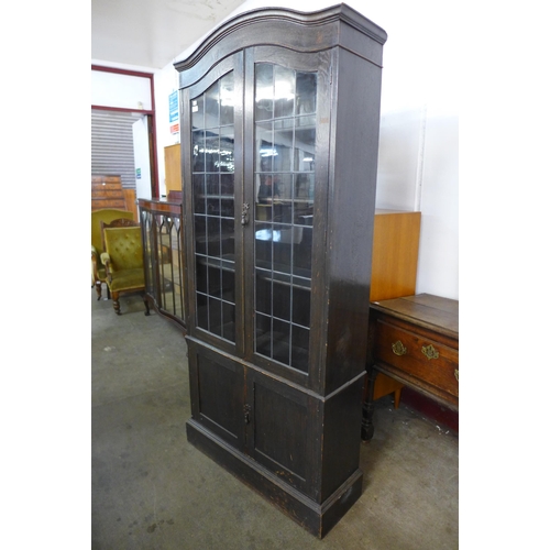 179 - An early 20th Century oak four door bookcase