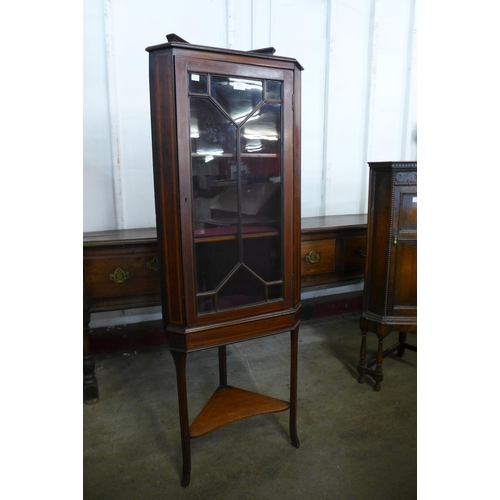 180 - An Edward VII inlaid mahogany freestanding splat front corner cabinet