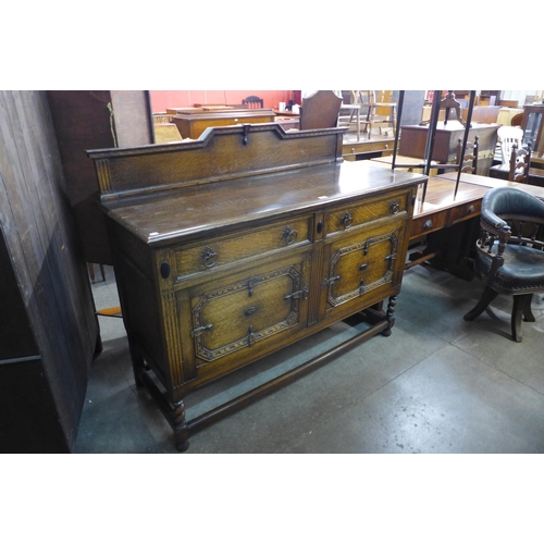 181 - An early 20th Century carved oak barleytwist sideboard