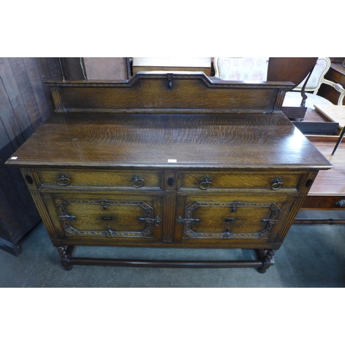 181 - An early 20th Century carved oak barleytwist sideboard