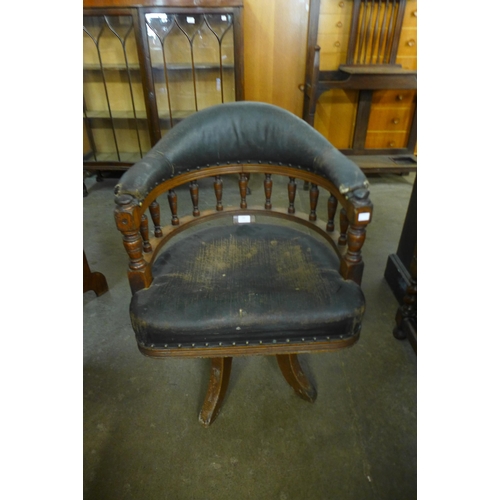 182 - A Victorian oak and upholstered revolving Captain's desk chair