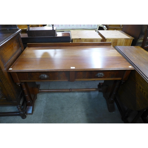 184 - A Victorian mahogany two drawer writing table