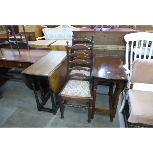 186 - A carved oak gateleg table and two chairs and another oak gateleg table