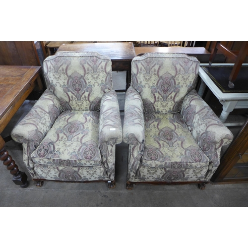 190 - A pair of early 20th Century Chippendale Revival carved mahogany and fabric upholstered armchairs