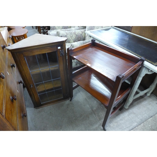 191 - A mahogany two tier trolley and an oak wall hanging corner cabinet