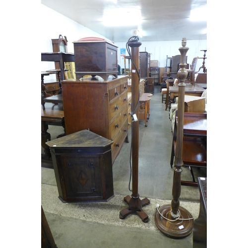 192 - Two beech standard lamps and an oak wall hanging corner cupboard