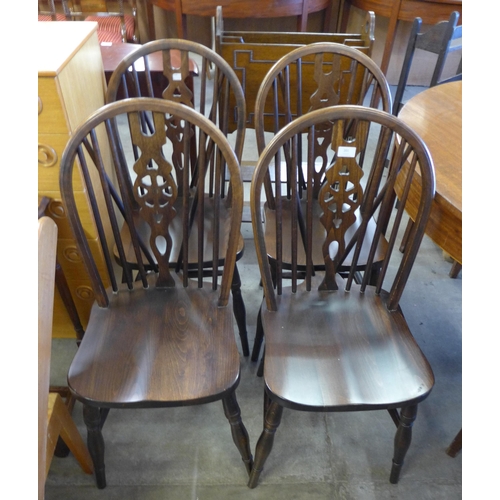 201 - A set of four beech wheelback kitchen chairs