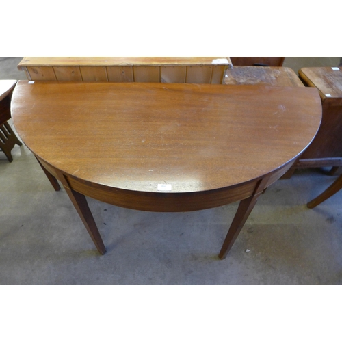 204 - A pair of George III mahogany demi-lune console tables