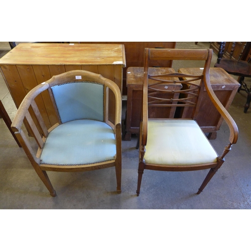 205 - An Arts and Crafts oak desk chair and an Edward VII inlaid mahogany elbow chair