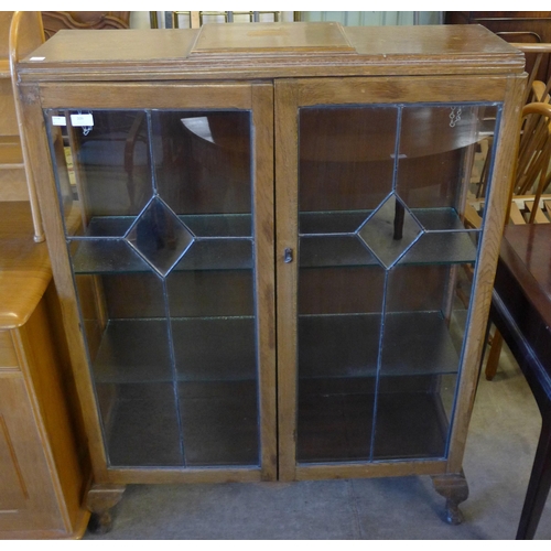 209 - An Art Deco oak display cabinet