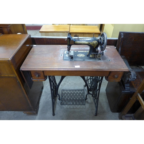 220 - A Singer treadle sewing machine