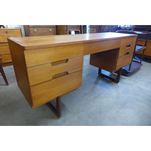 23 - A Uniflex teak desk