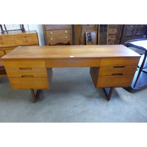 23 - A Uniflex teak desk