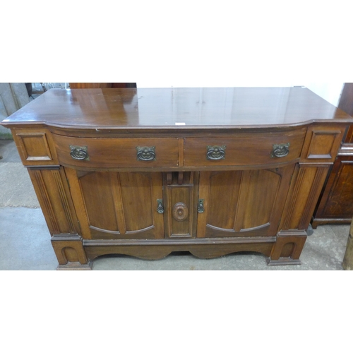 241 - An Arts and Crafts carved walnut sideboard