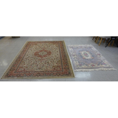 246 - An eastern beige ground rug and a Chinese rug