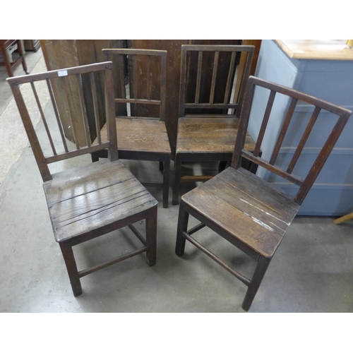 251 - A Harlequin set of four George III oak dining chairs