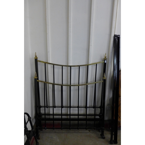 260 - A Victorian style brass and black metal 4ft bed