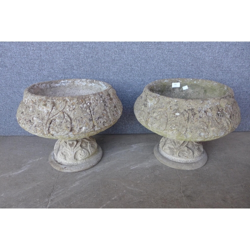 269 - A pair of concrete garden urns