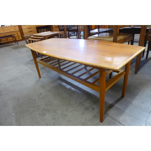 27 - A teak coffee table